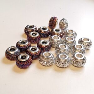 10+ 10 st plast/metall glitter pärlor 14x9mm